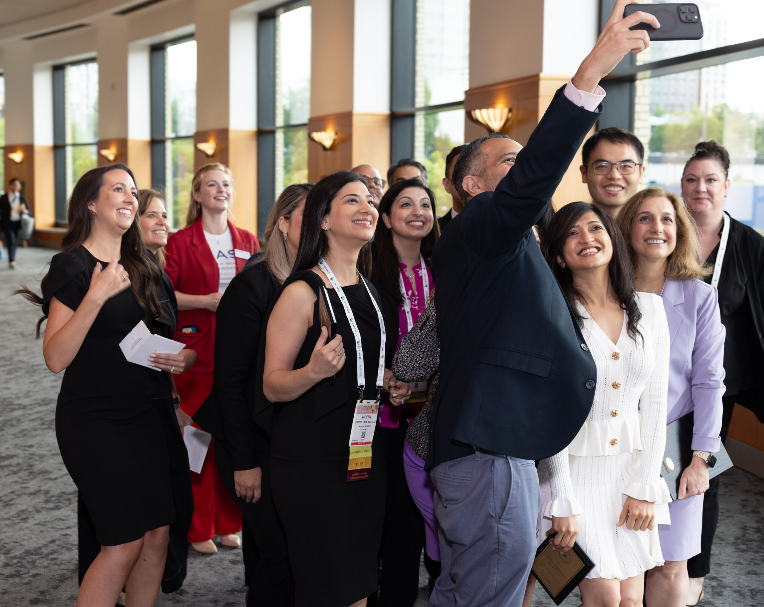 ASE 2024 6-15-24 - Tom Cook Photo-131 Man taking a selfie with colleagues
